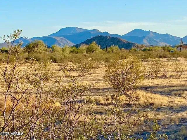 a view of a large body of water and mountain
