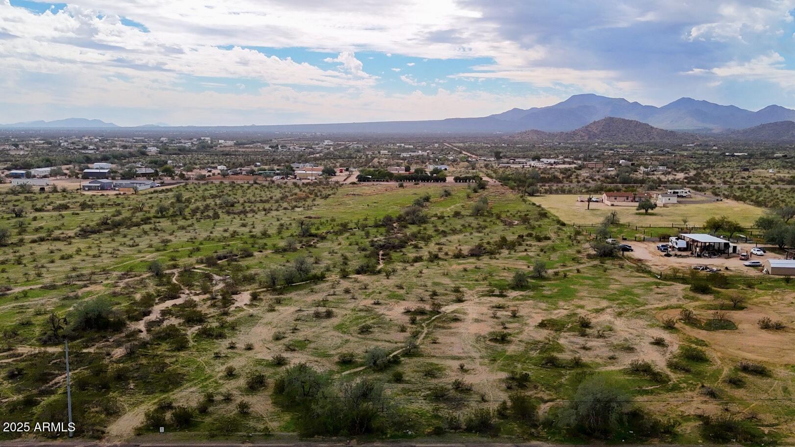 0 Huisatch Road, Unit 19 Maricopa, AZ 85139 - Photo 10 of 29 a view of a lake with mountains in the background
