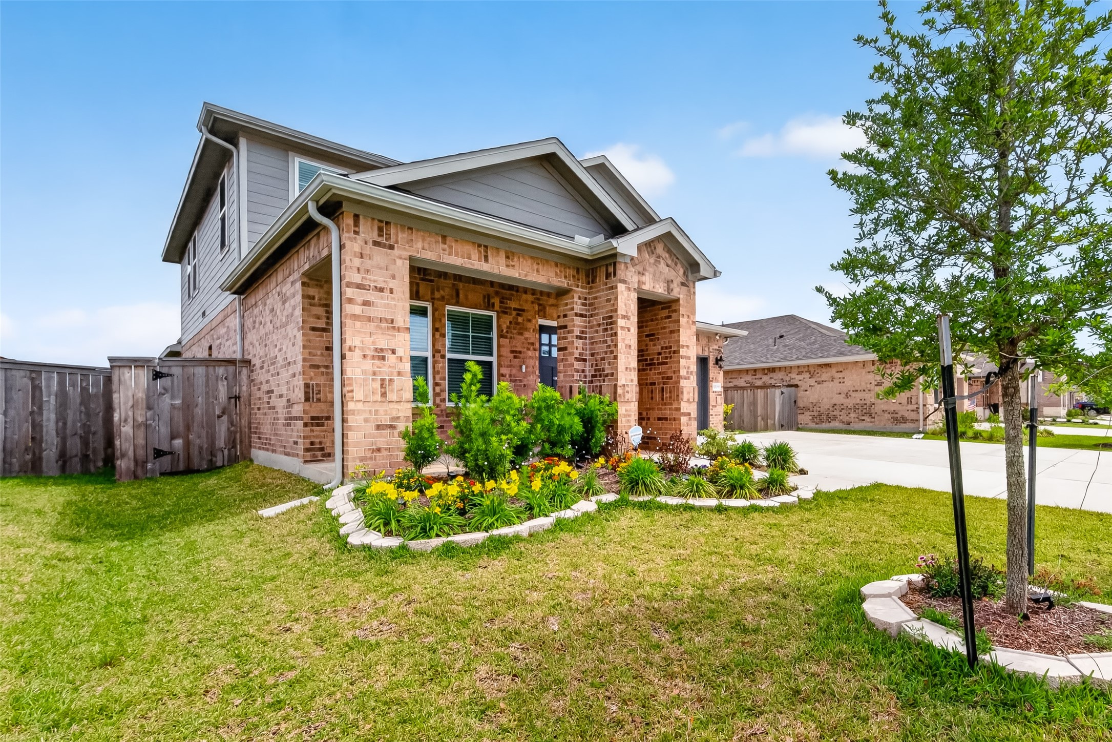 12119 Rushing Rdg Drive Baytown, TX 77523 - Photo 2 of 48 a front view of a house with a yard
