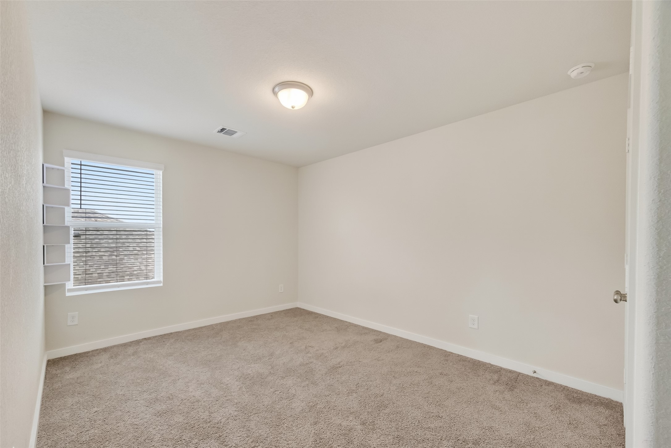12119 Rushing Rdg Drive Baytown, TX 77523 - Photo 30 of 48 an empty room with a window