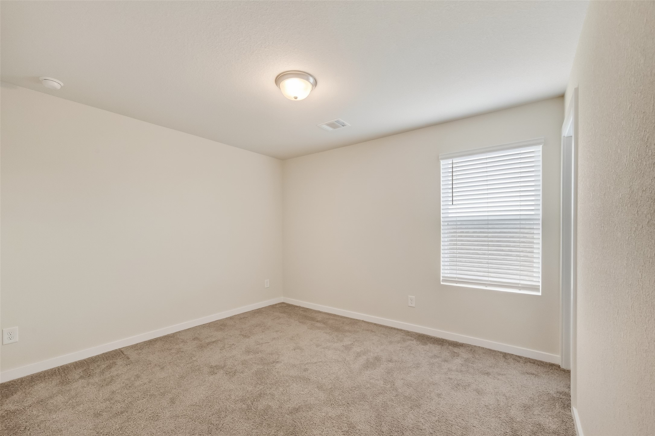12119 Rushing Rdg Drive Baytown, TX 77523 - Photo 33 of 48 an empty room with a window
