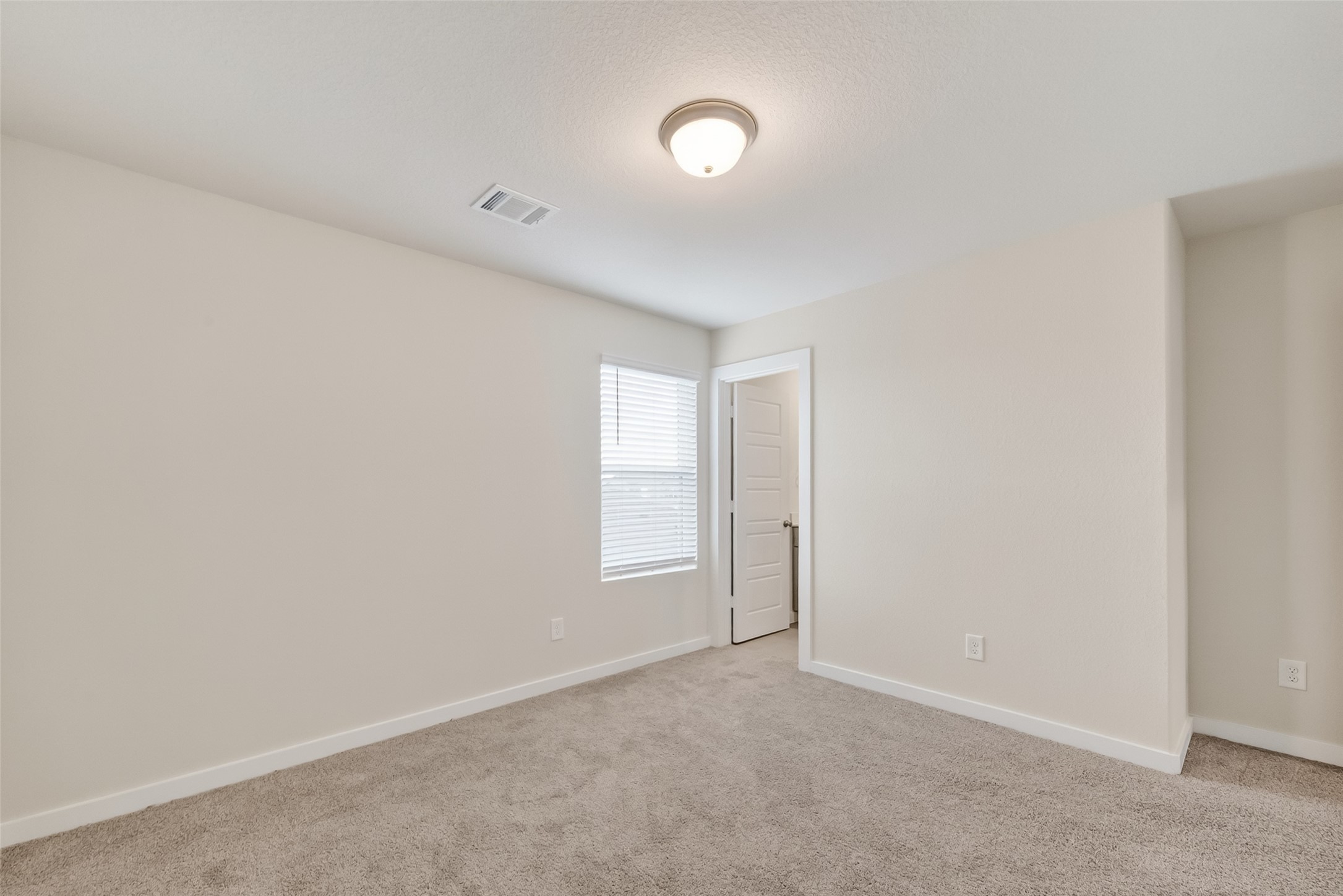 12119 Rushing Rdg Drive Baytown, TX 77523 - Photo 35 of 48 a view of an empty room and a window