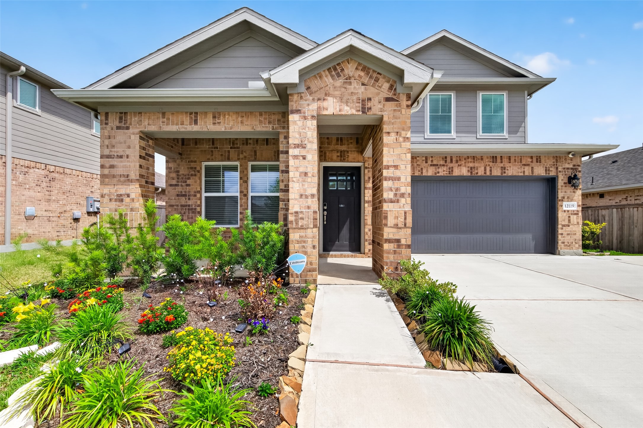 12119 Rushing Rdg Drive Baytown, TX 77523 - Photo 4 of 48 front view of a house with a yard