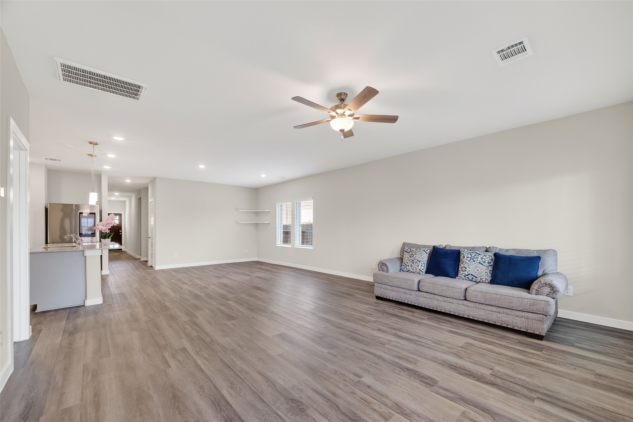 12119 Rushing Rdg Drive Baytown, TX 77523 - Photo 5 of 48 a living room with furniture and a wooden floor