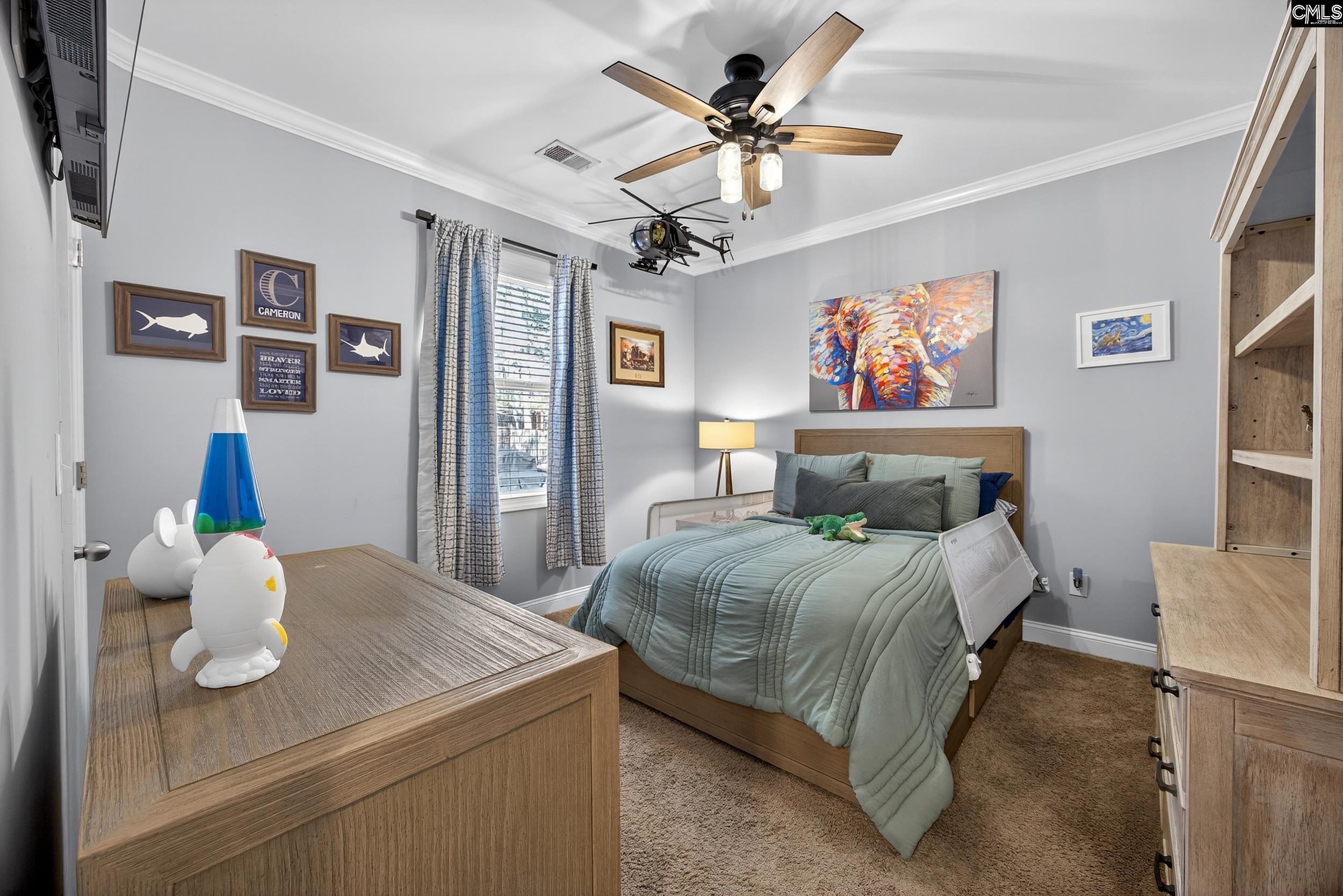 116 Renard Way Gilbert, SC 29054 - Photo 43 of 74 a bedroom with a bed and wooden floor