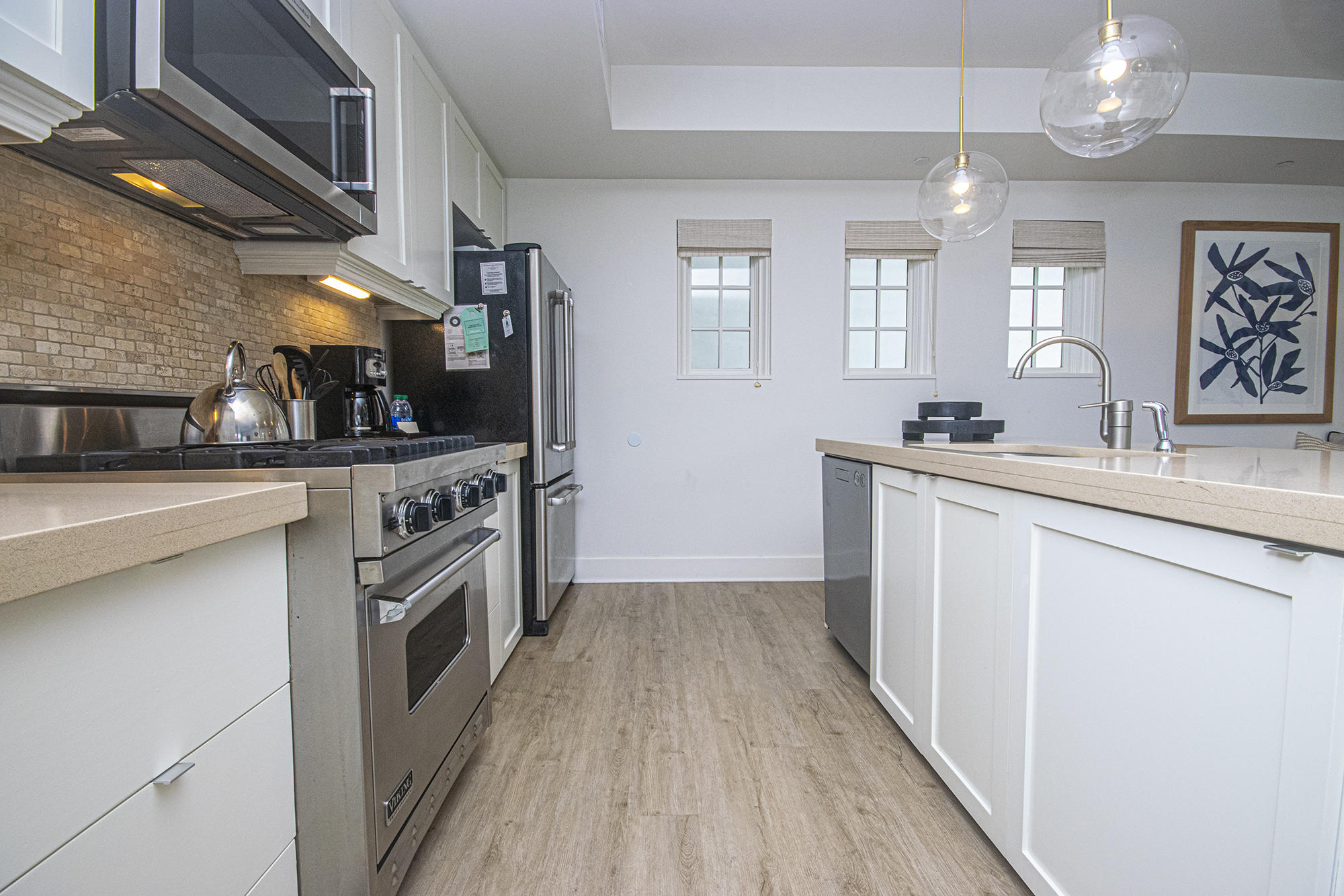 136 Georgetown Avenue, Unit A16 Inlet Beach, FL 32461 - Photo 25 of 57 a kitchen with stainless steel appliances a sink and a stove