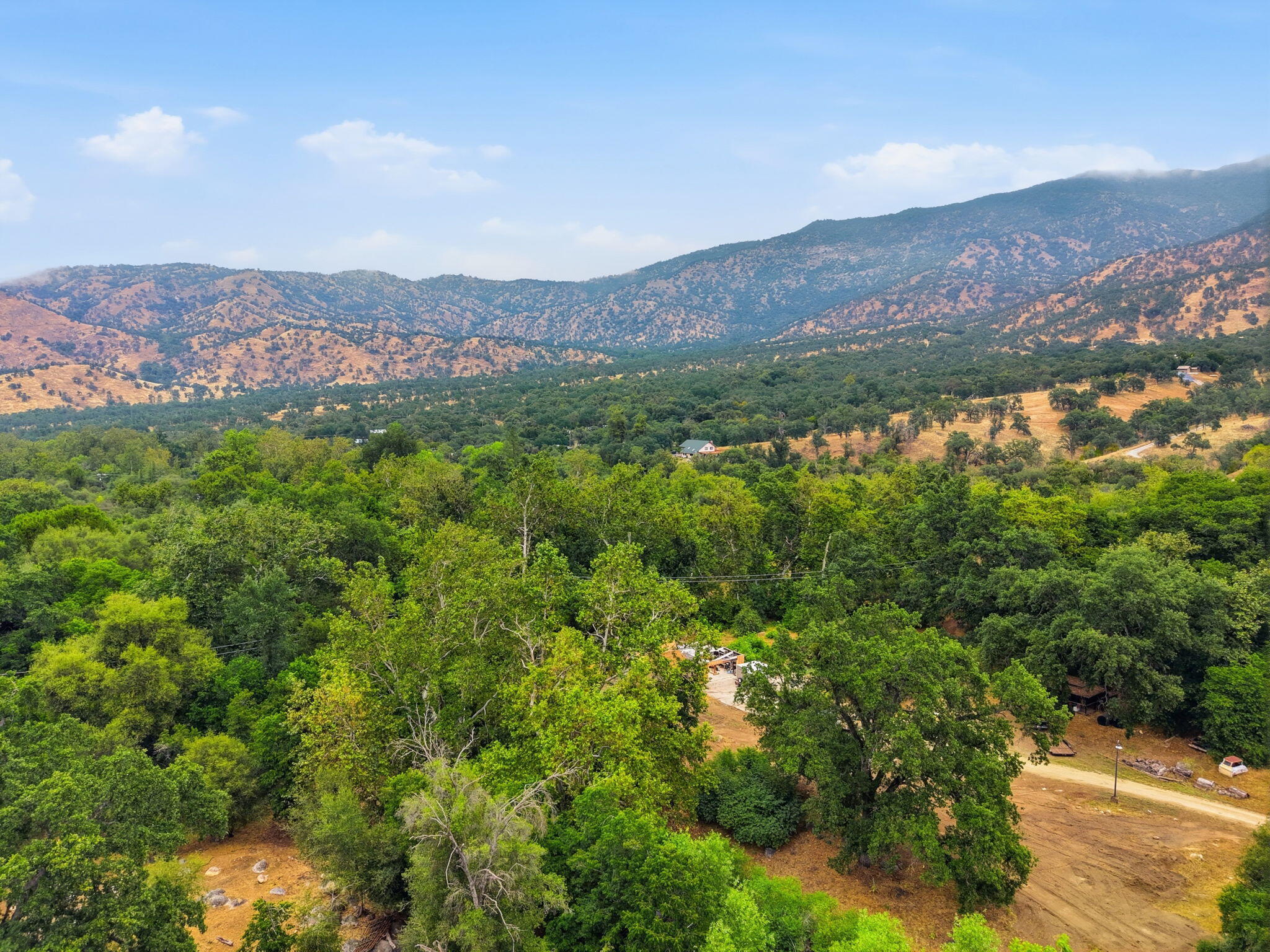 44065 South Fork Drive Three Rivers, CA 93271 - Photo 25 of 33 a view of a lush green field with mountains in the background