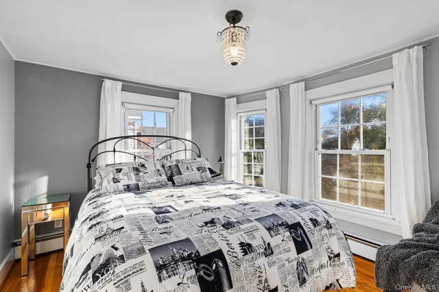 a bedroom with a large bed and a window