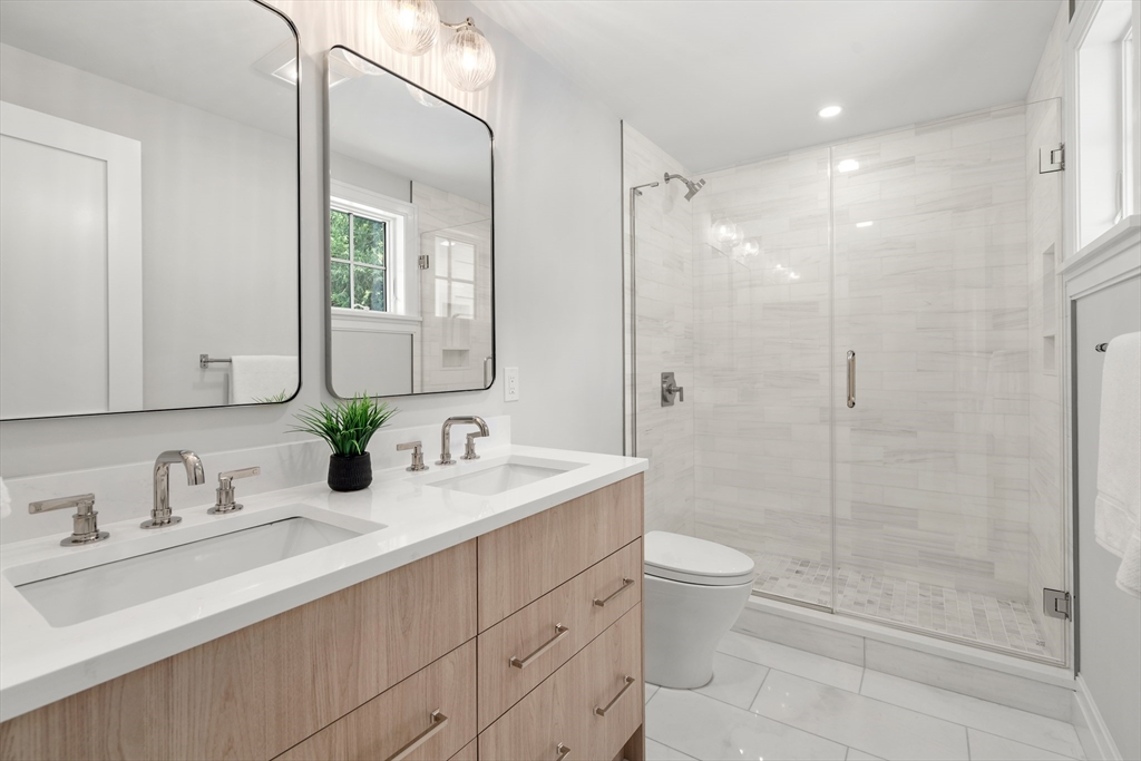 28 Parker Road Wellesley, MA 02482 - Photo 25 of 32 a bathroom with double vanity sink toilet and shower