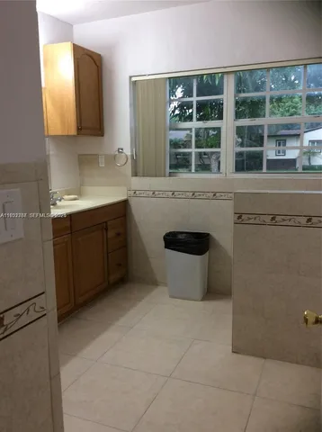 a view of a sink and a dishwasher in a kitchen