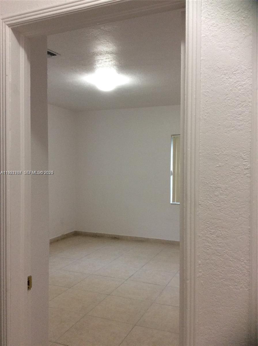 60 Palmetto Drive Miami Springs, FL 33166 - Photo 7 of 12 a view of empty room