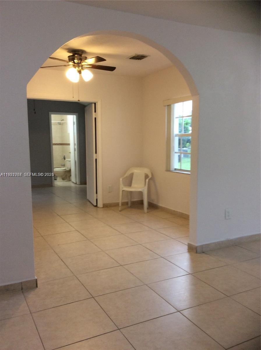 60 Palmetto Drive Miami Springs, FL 33166 - Photo 8 of 12 a view of a livingroom with furniture and windows