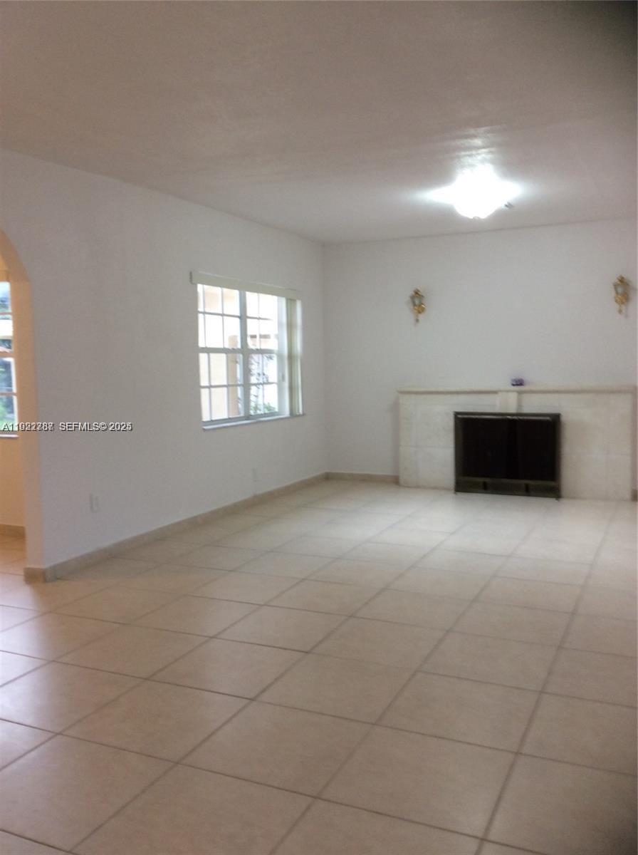 60 Palmetto Drive Miami Springs, FL 33166 - Photo 9 of 12 an empty room with windows