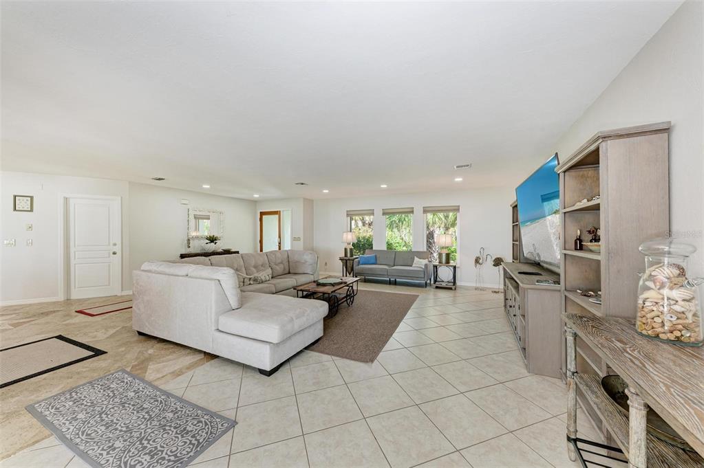 8320 Manasota Key Road Englewood, FL 34223 - Photo 12 of 58 a living room with furniture and a couch