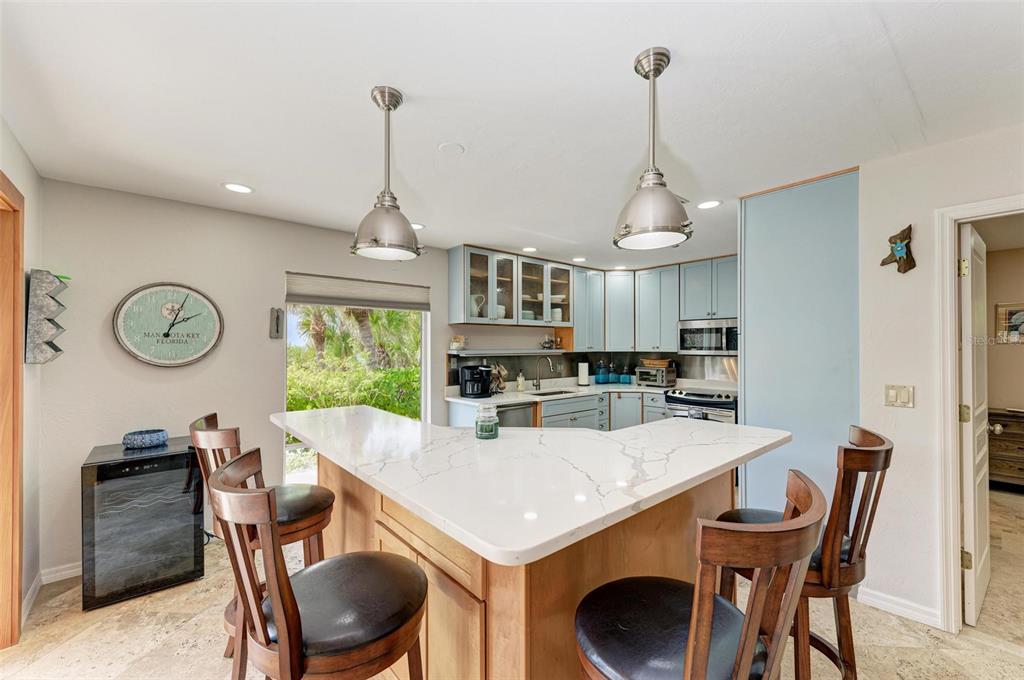 8320 Manasota Key Road Englewood, FL 34223 - Photo 19 of 58 a view of a dining room with furniture window and wooden floor