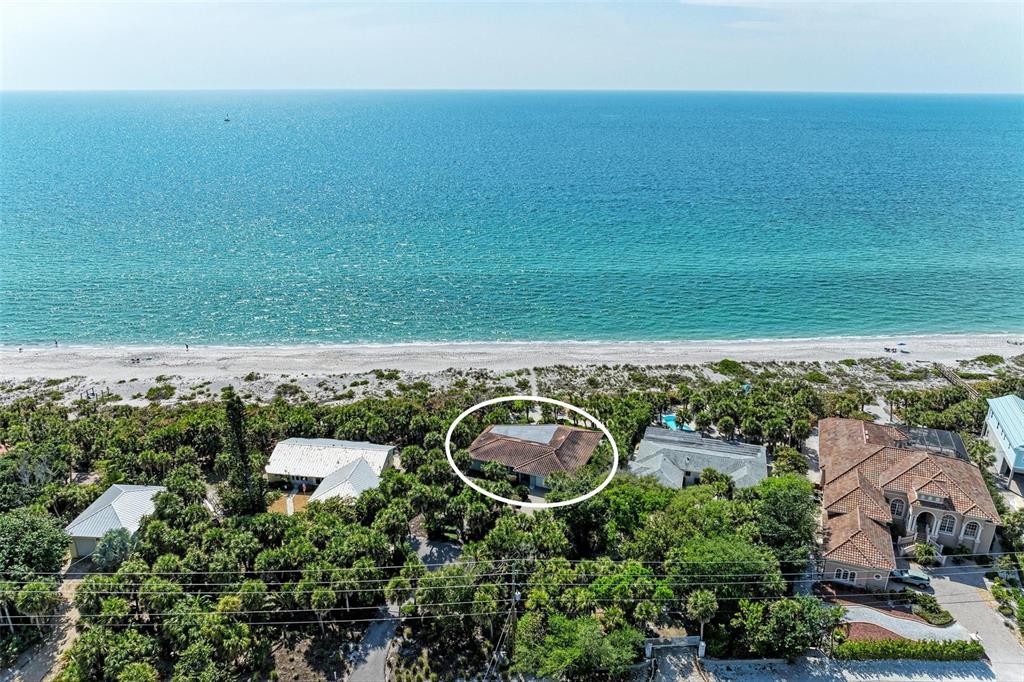 8320 Manasota Key Road Englewood, FL 34223 - Photo 2 of 58 an aerial view of a house with a yard