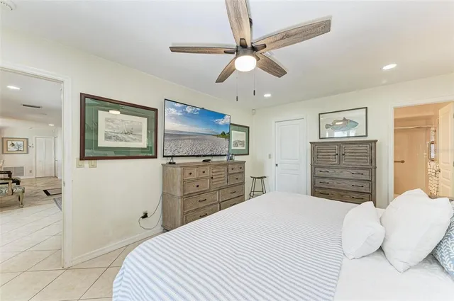 a living room with furniture and large windows