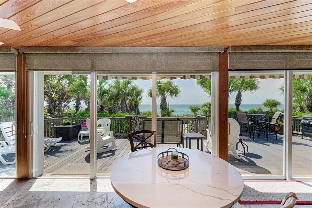 8320 Manasota Key Road Englewood, FL 34223 - Photo 37 of 58 a dining room with furniture and a window