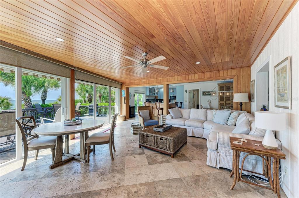 8320 Manasota Key Road Englewood, FL 34223 - Photo 39 of 58 a living room with furniture and a large window