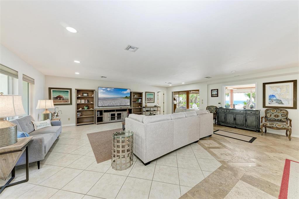 8320 Manasota Key Road Englewood, FL 34223 - Photo 9 of 58 a living room with furniture and a flat screen tv
