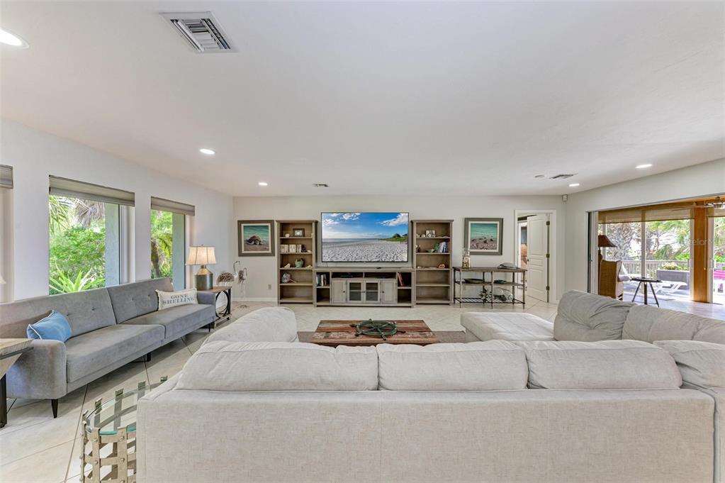 8320 Manasota Key Road Englewood, FL 34223 - Photo 10 of 58 a living room with furniture and a large window