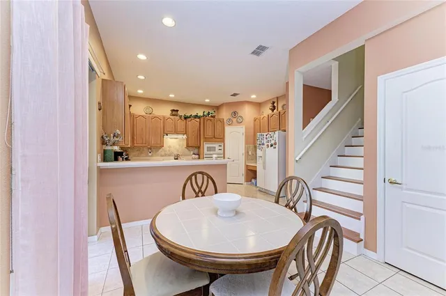 a kitchen with a sink cabinets and window
