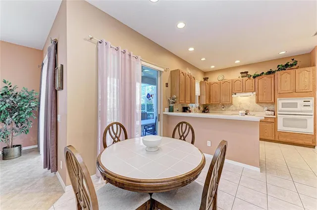 a kitchen with stainless steel appliances a refrigerator sink and cabinets