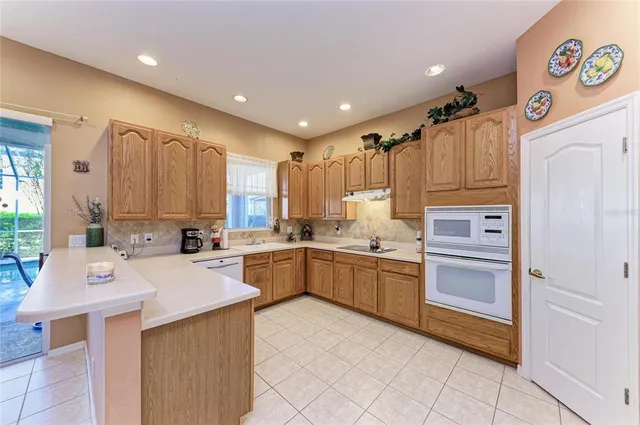 a bathroom with a sink a toilet and a shower curtain