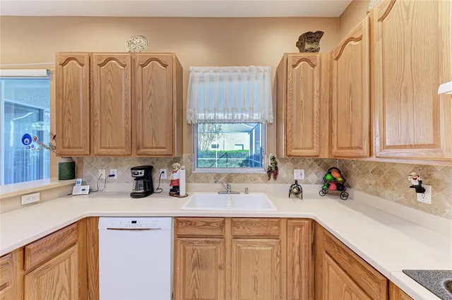 a spacious bedroom with a bed and a chandelier
