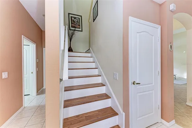 a bed room with a bed and a chair