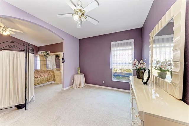 a bedroom with a bed and cabinets