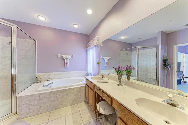 a room with a bed and a mirror on dresser