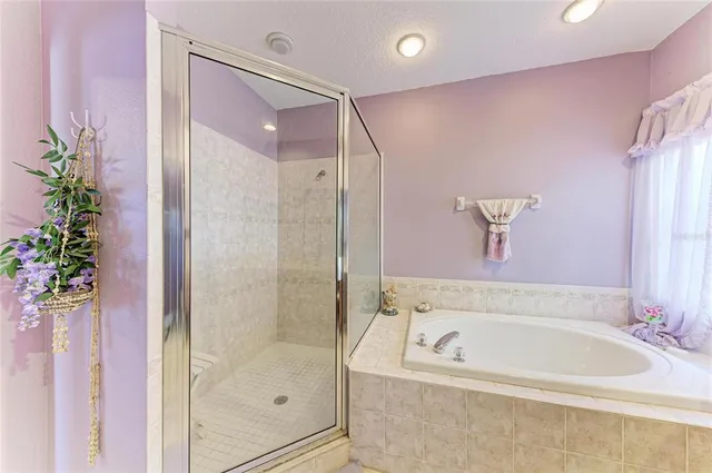 a bedroom with a bed and a desk