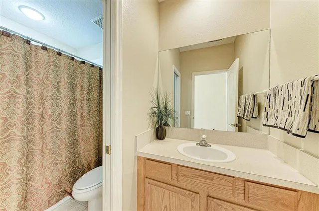 a view of a house with yard and tree s