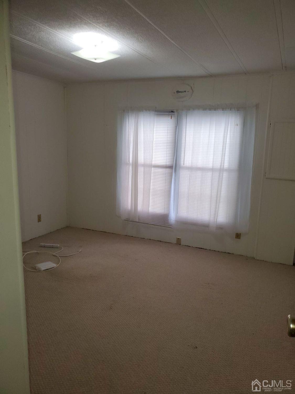 35 Dickens Road North Brunswick, NJ 08902 - Photo 11 of 15 an empty room with a windows