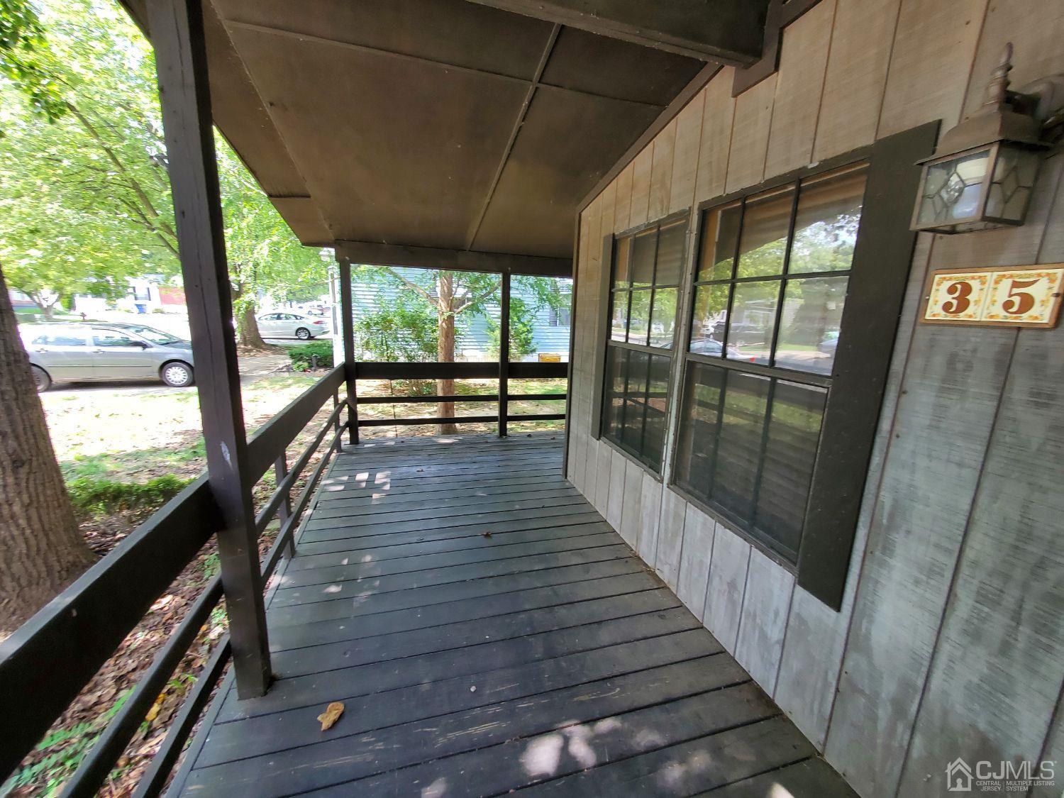 35 Dickens Road North Brunswick, NJ 08902 - Photo 3 of 15 a view of balcony with wooden floor