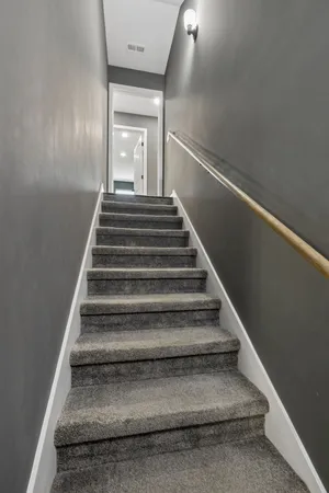 a view of a balcony with furniture