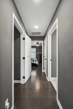 a view of a chairs and table in a wooden roof deck