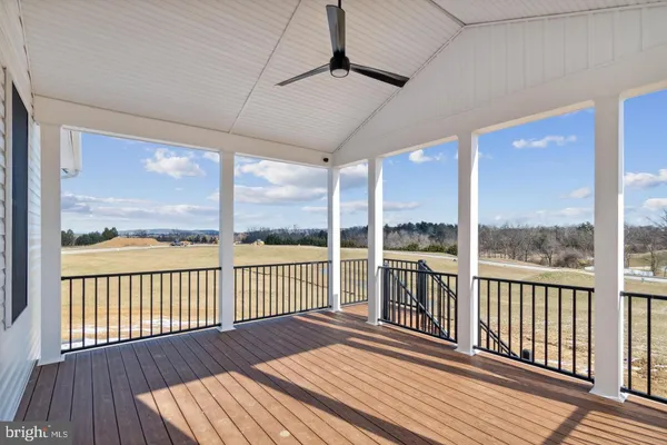 a view of a balcony with wooden floor