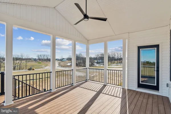 a view of a balcony with wooden floor