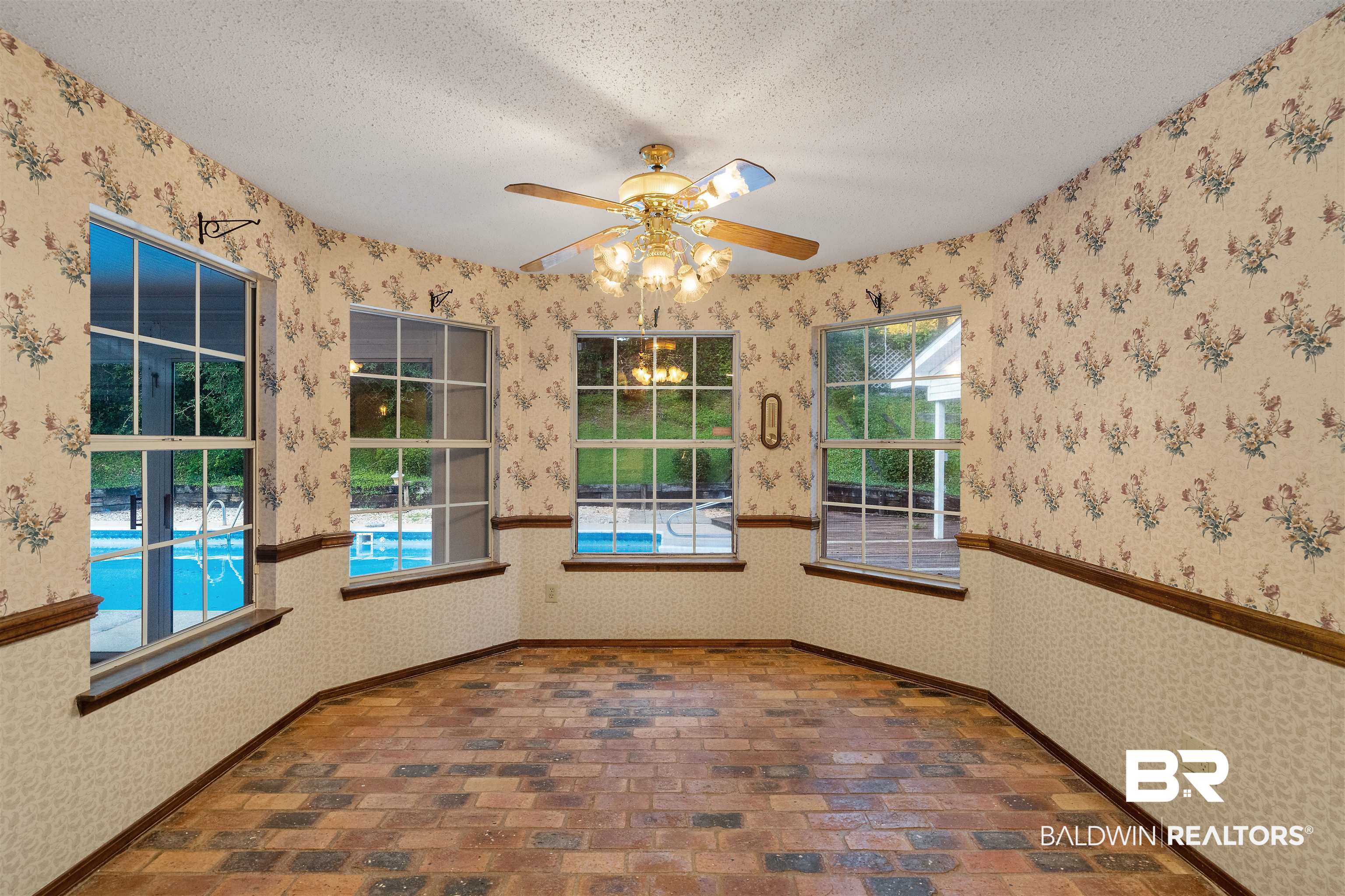 438 Ridgewood Drive Daphne, AL 36526 - Photo 11 of 28 Spare room featuring a textured ceiling and ceiling fan