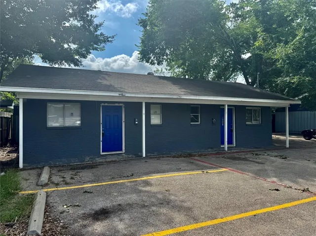 a view of a room with a window and a ceiling fan