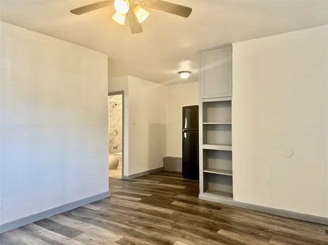 a kitchen with stainless steel appliances a refrigerator and cabinets