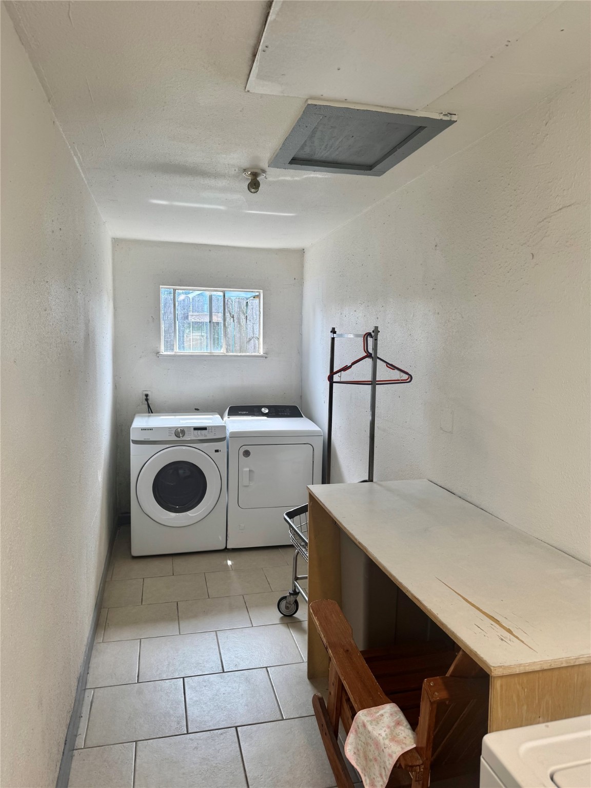 1001 Spooner Street, Unit C Pasadena, TX 77506 - Photo 9 of 9 a utility room with dryer and washer