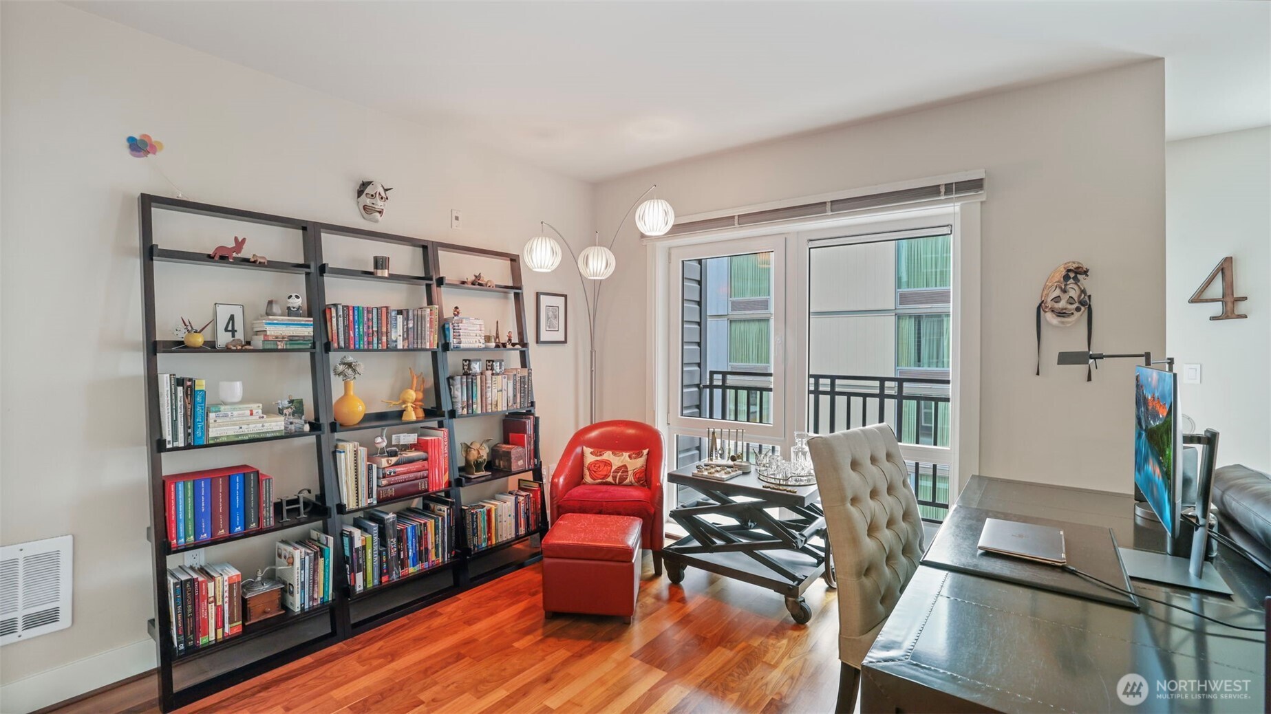 699 John Street, Unit 513 Seattle, WA 98109 - Photo 12 of 33 a bedroom with furniture and a book shelf