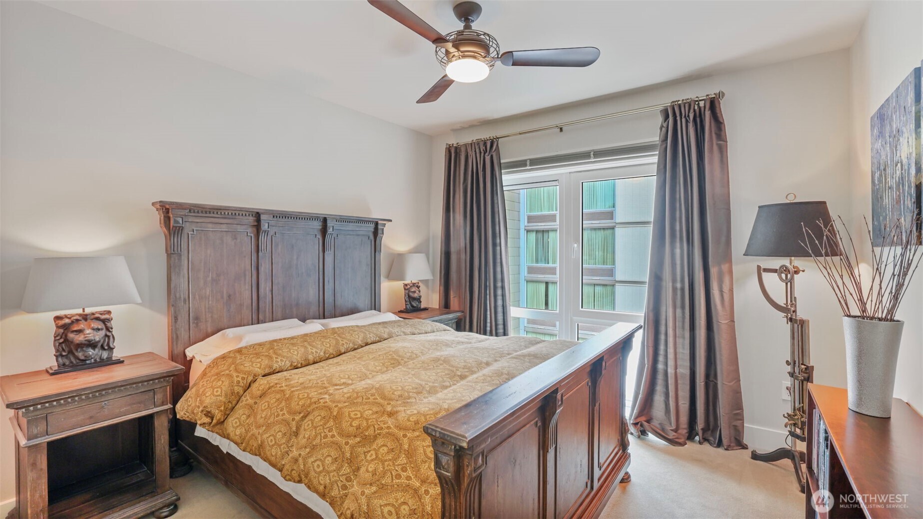 699 John Street, Unit 513 Seattle, WA 98109 - Photo 16 of 33 a bed sitting in a bedroom next to a window