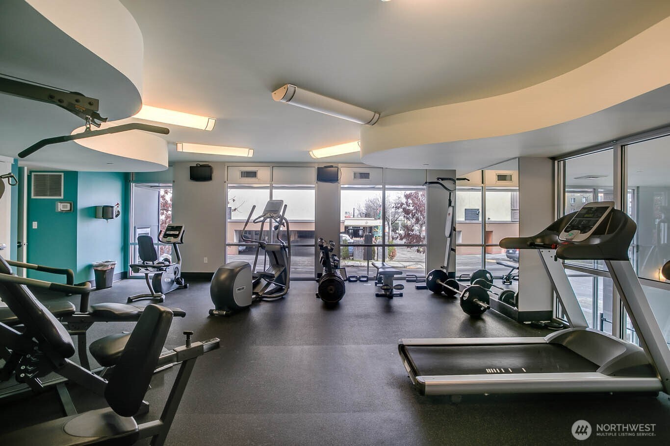 699 John Street, Unit 513 Seattle, WA 98109 - Photo 26 of 33 a room with gym equipment and a large window