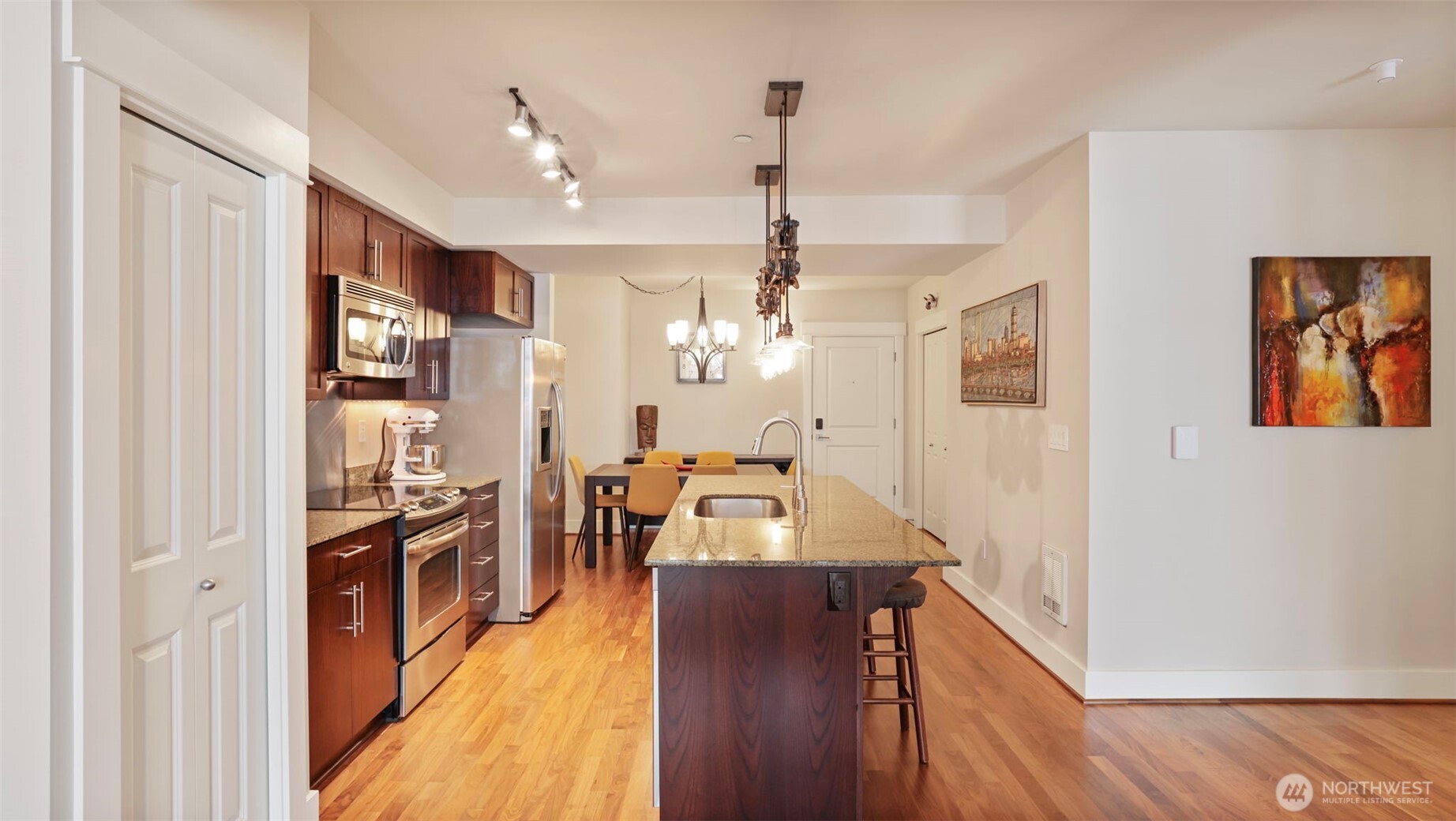 699 John Street, Unit 513 Seattle, WA 98109 - Photo 7 of 33 a view of a kitchen and dining room