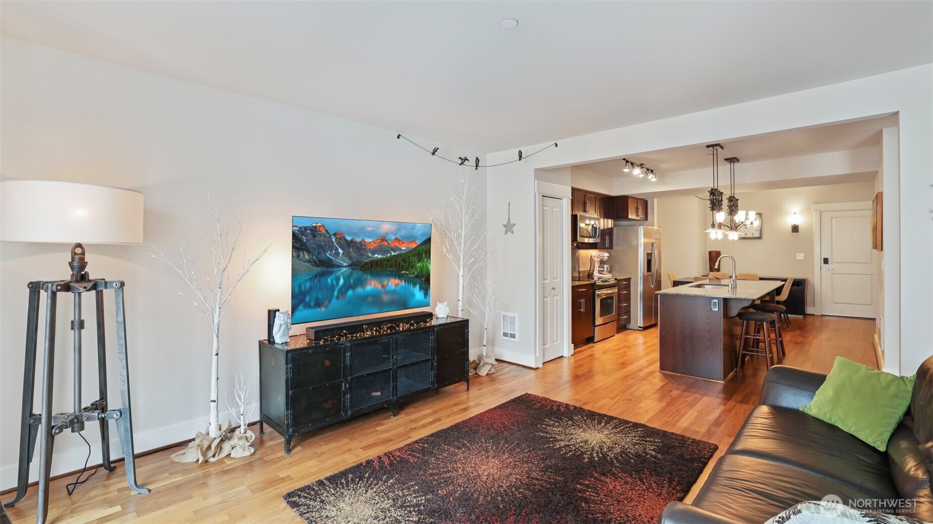 699 John Street, Unit 513 Seattle, WA 98109 - Photo 9 of 33 a living room with furniture and a flat screen tv