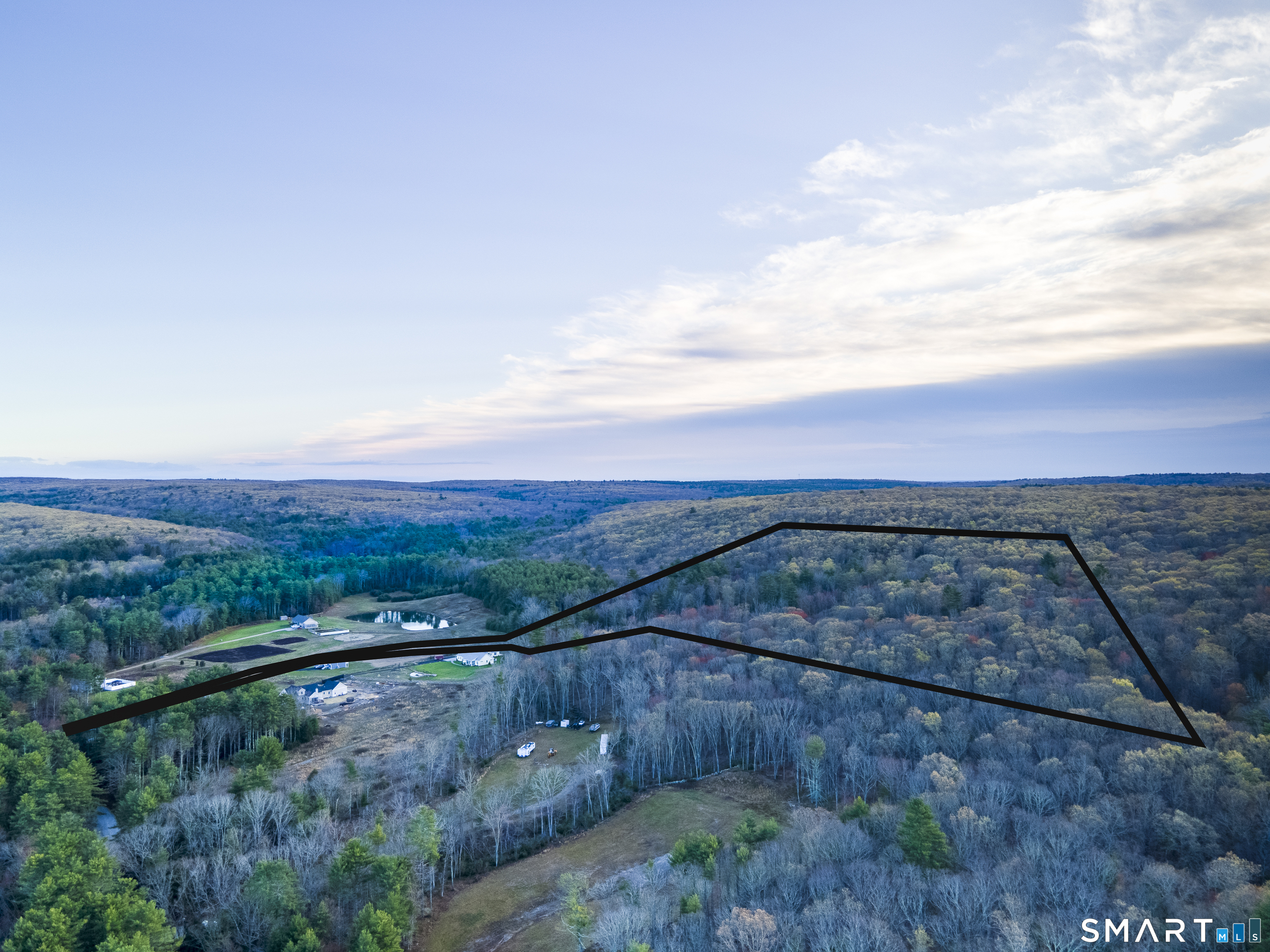 0 New Road Thompson, CT 06277 - Photo 5 of 7 a view of a city with lush green forest